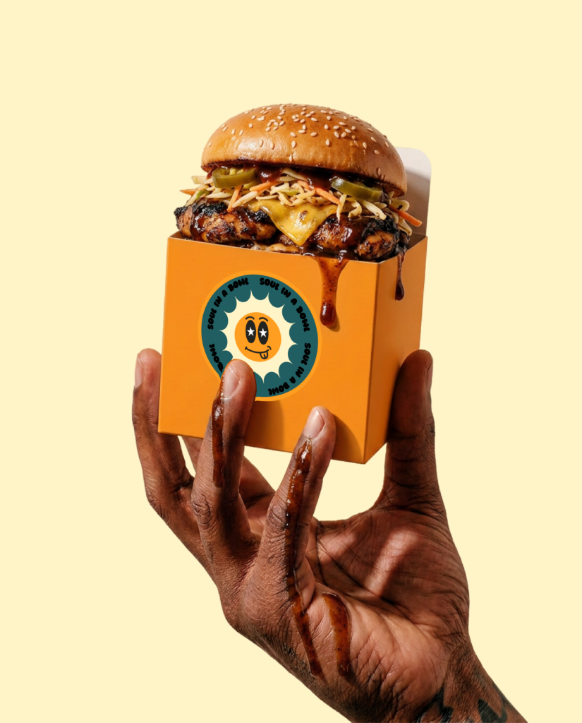 custom made burger box design for a local Caribbean food truck showcasing brand identity, custom typography and colour palette 